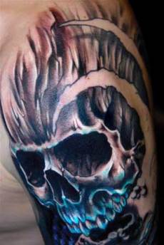A 3D skull tattoo on man's arm.